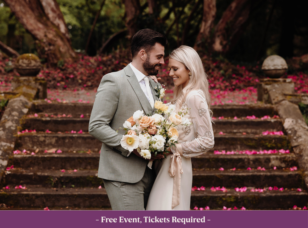 Wedding Showcase Meridian Sunken Garden in Johnstown Castle Wexford, steps covered in pink petals. Wedding couple looking at each other smiling.