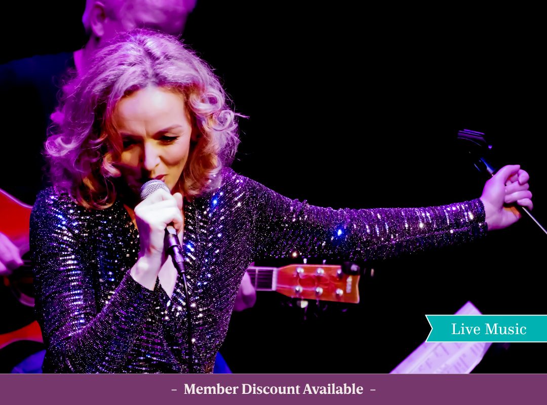 Imelda Kehoe performing on stage, singing live into a microphone. Includes text that says " Members Discount Available"