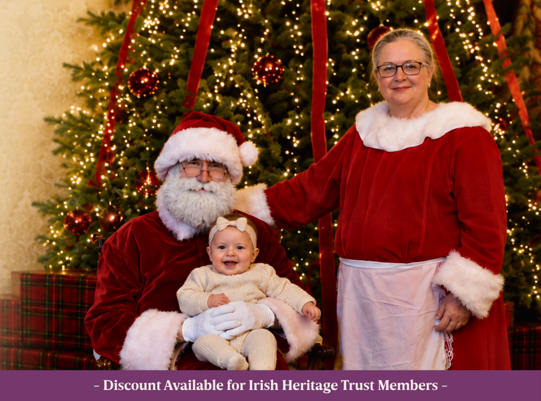 ‘s First Christmas Web Pic Santa, Mrs Claus and a baby in Johnstown Castle in front of the Christmas Tree.